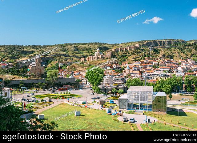 Scenic View Of Park Rike In Tbilisi, Georgia. In Background Is Visible Metekhi Church, Narikala Fortress, Old Historic District Of Kala, Cableway