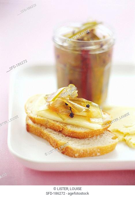 Pickled watermelon rind with Cheddar cheese on white bread