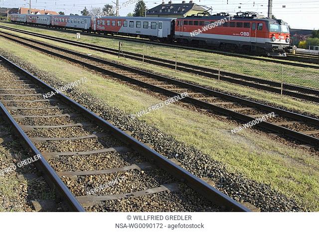 tracks and a red railcar locomotive Austrian Federal Railways