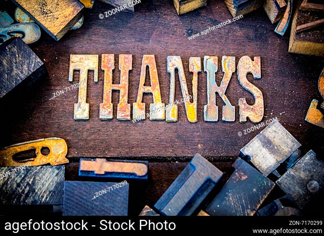 The word THANKS written in rusted metal letters surrounded by vintage wooden and metal letterpress type