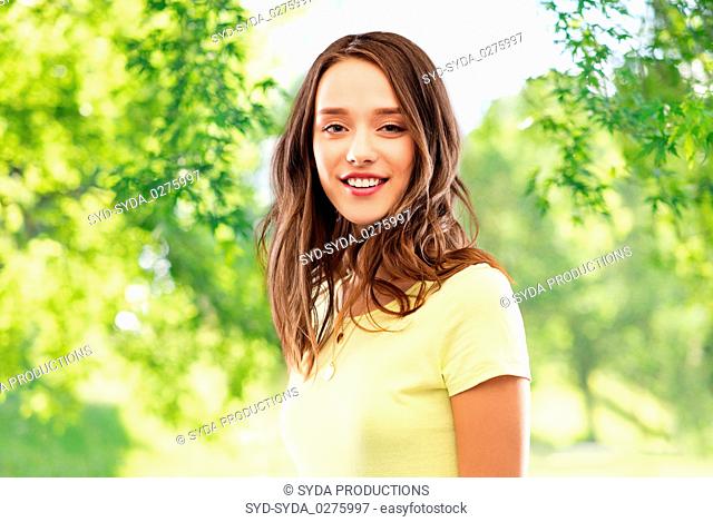 young woman or teenage girl in yellow t-shirt
