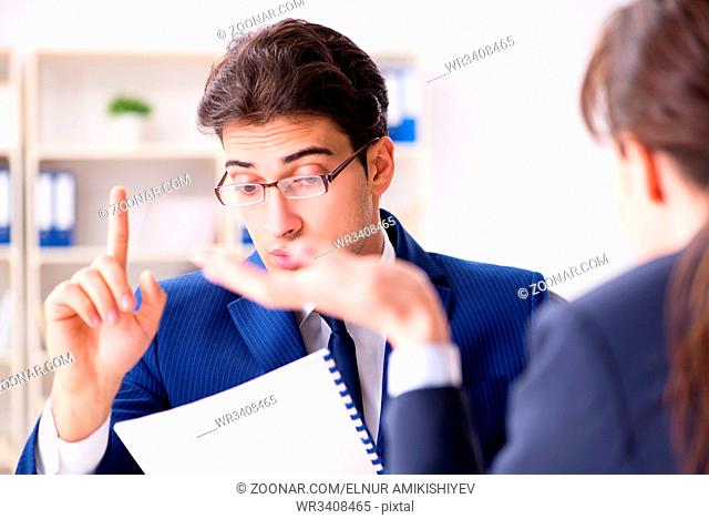 Lawyer talking to his client in office