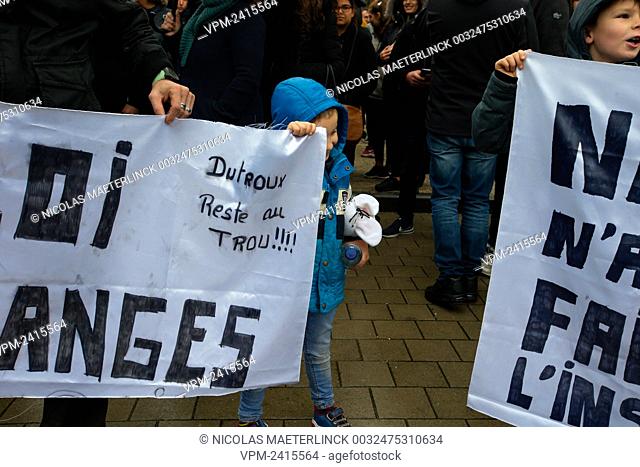 Illustration picture shows a protest through Brussels as a black march to protest against a possible conditional release of a convicted criminal of children