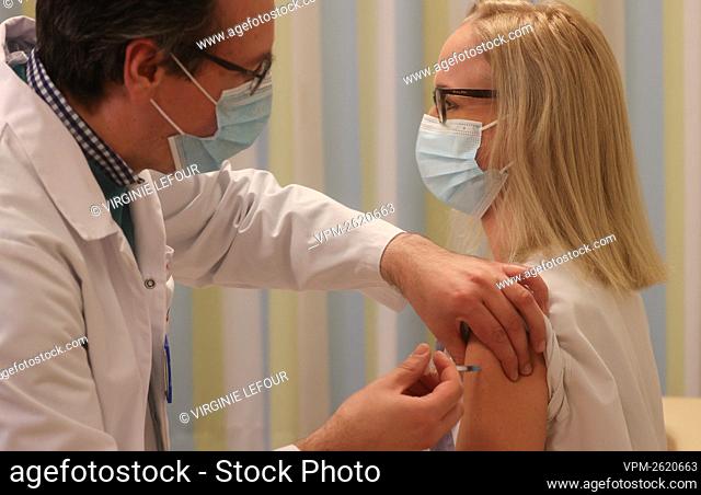A member of the staff receives the vaccine during the vaccination of the residents of the Quietude elderly home in Montigny-le-Tilleul, near Charleroi