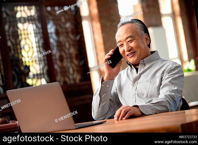 The elderly using a mobile phone call