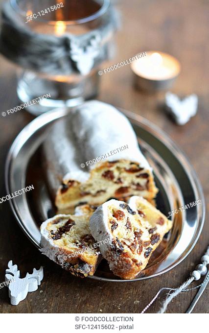 Christmas stollen, sliced, on a small tray