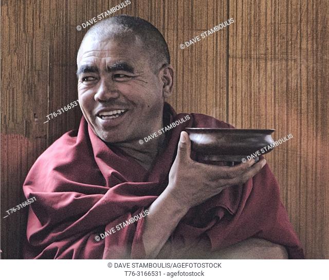 Gelugpa monk drinking butter tea, Diskit Monastery, Nubra Valley, Ladakh, India