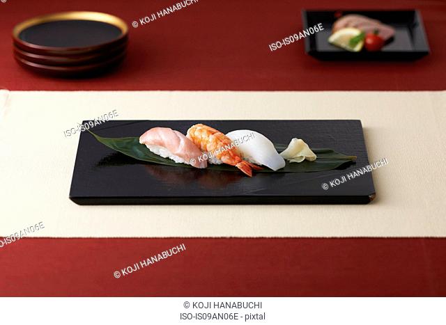 Granite chopping board with seafood on leaf