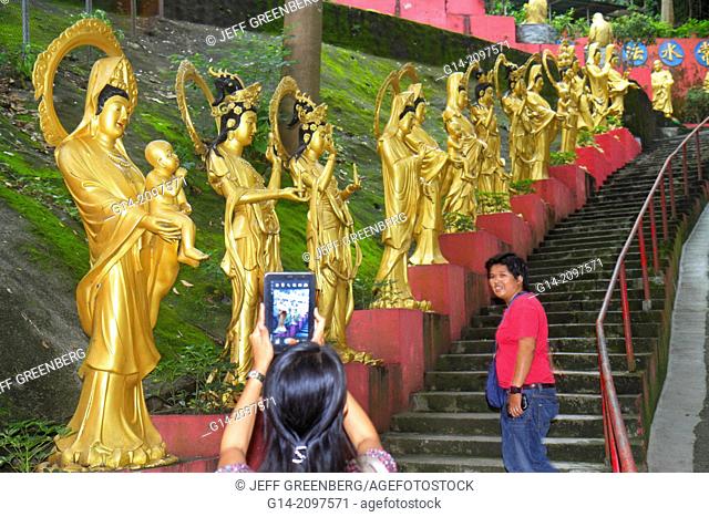 China, Hong Kong, New Territories, Sha Tin, Ten Thousand 10, 000 Buddhas Monastery, golden, path, statues, Buddha, Buddhism, Asian, woman, tablet, iPad