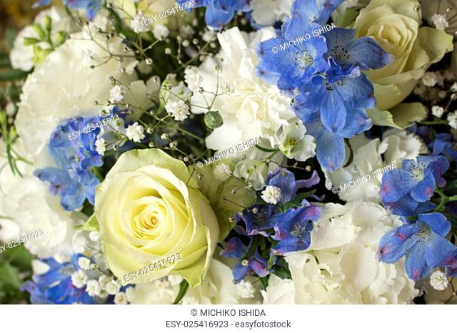 Roses, carnation, Texas bluebell & delphinium flower bouquet