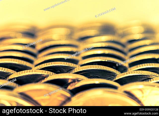 Stack of golden coins macro. Rows of coins for finance and banking concept. Economy trends background for business idea and all art work design