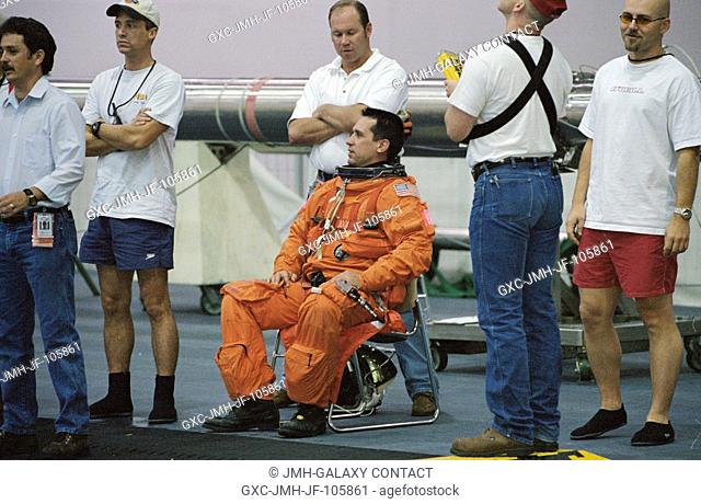 Astronaut William A. Oefelein, STS-116 pilot, attired in a training version of the shuttle launch and entry suit, waits for the start of a training session in...