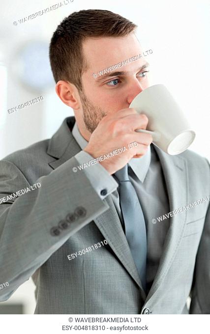 Portrait of a businessman drinking tea