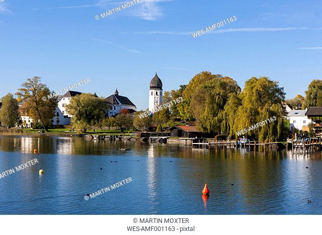 Germany, Bavaria, Upper Bavaria, Chiemgau, View of Frauenchiemsee Island at Lake Chiemsee, tower of the Order of Saint Benedict