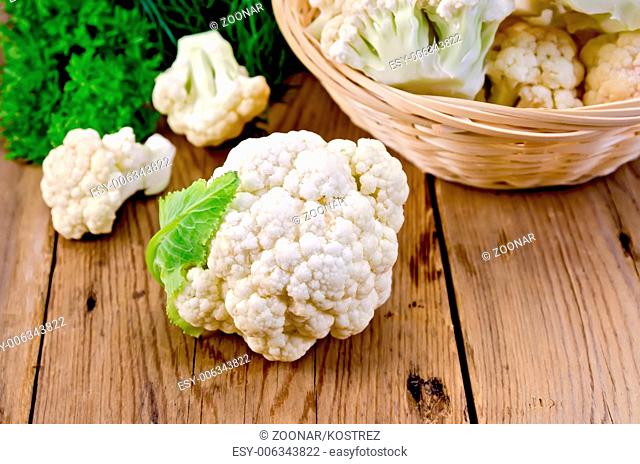 Cauliflower with a basket on the board