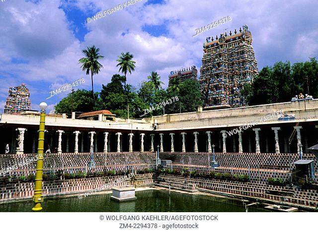 Courtyard with pool of the Meenakshi Amman Temple, which is a historic Hindu temple built in 1560 and located on the southern bank of the Vaigai River in the...