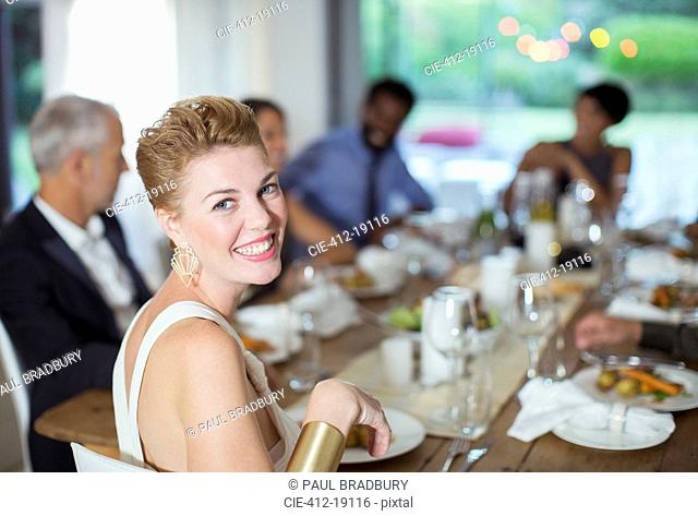 Woman smiling at dinner party