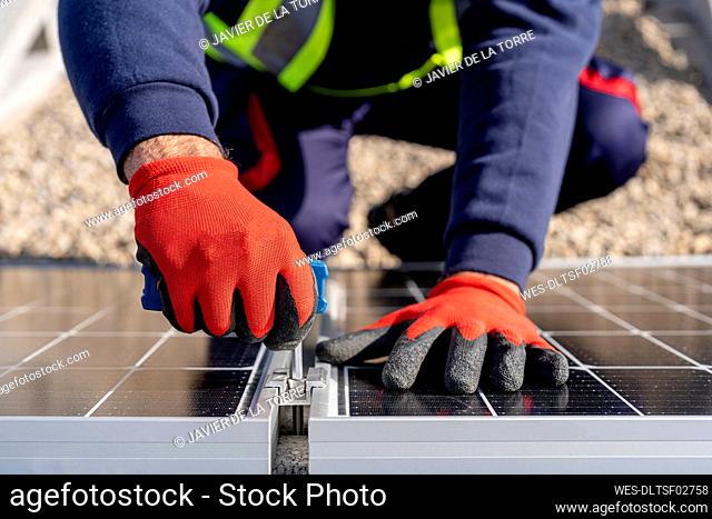 Technician assembling solar panels