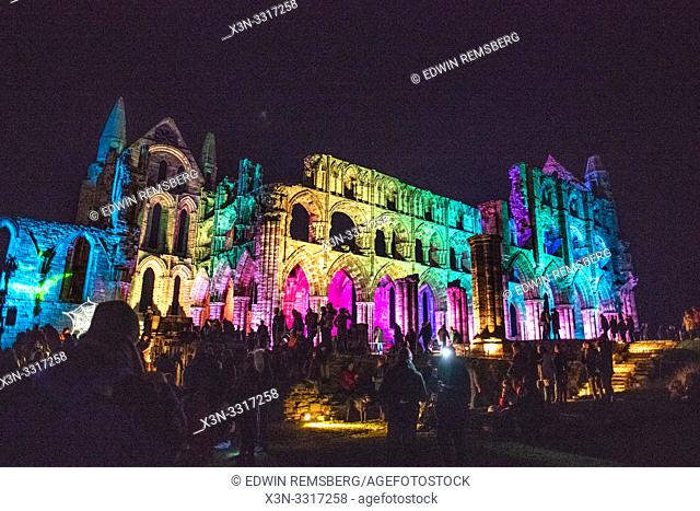 A crowd and lights from the Whitby Abbey during the Dracula festival on Halloween Yorkshire, UK