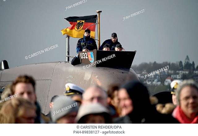 Crew members of the submarine 32 follow the landing of the Elbe-class replenishment ship 'Main' in Eckernfoerde, Germany, 13 April 2017