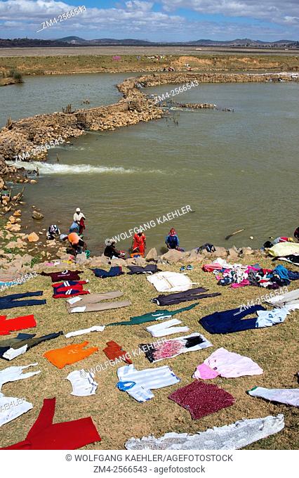 People washing laundry in river on the outskirts of Antananarivo, the capital city of Madagascar