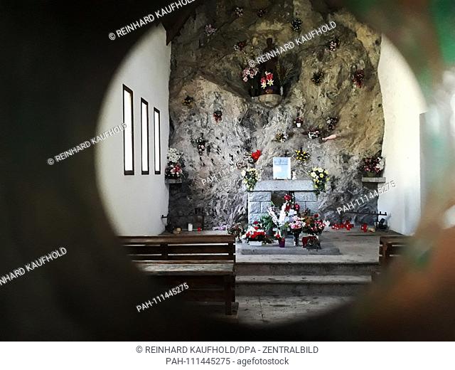 Hike in the National Park Aiguestortes along the Monastero Valley in the Spanish Pyrenees - View into the interior of a locked mountain church, shot on 14
