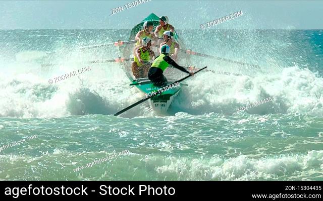 ALEXANDRA HEADLAND, QUEENSLAND, AUSTRALIA- APRIL 24, 2016: the view from the beach of a surf boat race at alexandra headland on the sunshine coast of australia