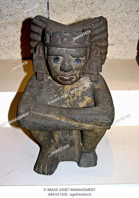 seated figure of Xiuhtecuhtli the Aztec goddess of Fire. AD 1325-1521 From Mexico. This figure represents Xiuhtecuhtli, the Mexica god of fire