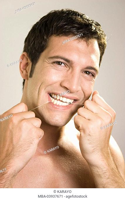 Man, attractively, tooth-care, dental floss, portrait