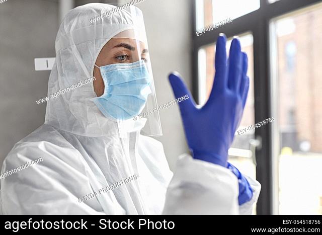 doctor in protective wear, mask and face shield