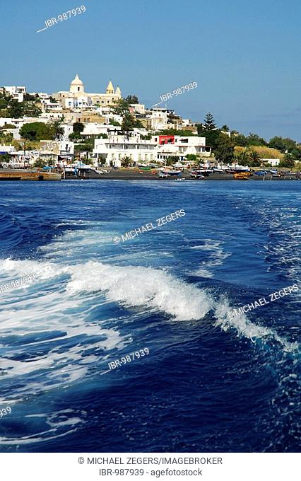 Waves in front of a white village on Stromboli Island, Aeolian or Lipari Islands, Tyrrhenian Sea, Sicily, South Italy, Italy, Europe