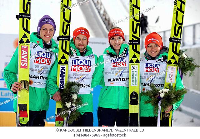 L-R: Andreas Wellinger, Markus Eisenbichler, Svenja Würth and Carina Vogt from Germany celebrate at the Nordic World Ski Championships in Lahti, Finland