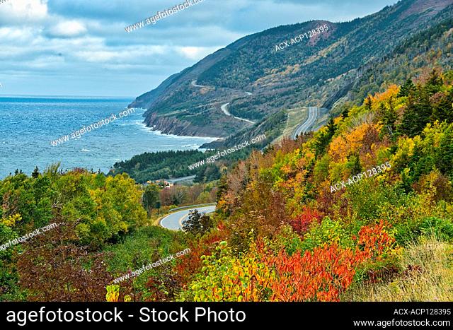 The Cabot Trail along the Gulf of St. Lawrence meanders through the Acadian forest in autumn foliage Cape Breton Highlands National Park Nova Scotia Canada