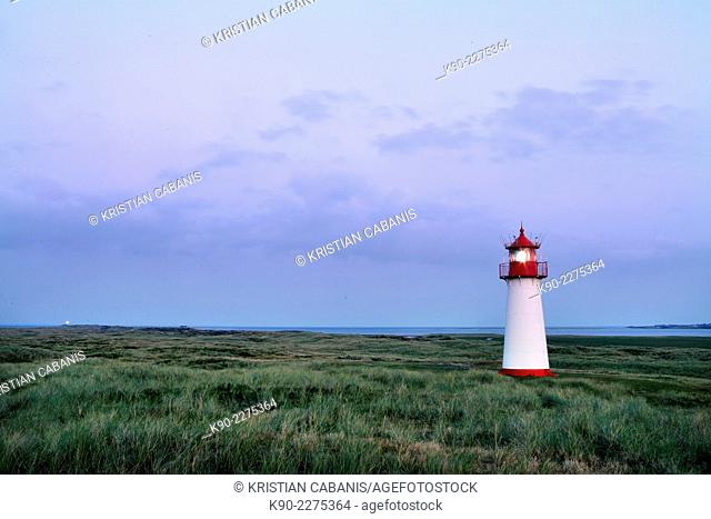 Lighthouse List West with light on in the dunes, with beach and North Sea, Sylt, North Frisian Islands, Schleswig-Holstein, Germany, Europe