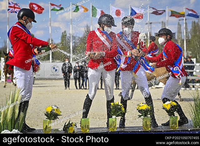Czech team, Ales Opatrny, from left, Anna Kellnerova, Kamil Papousek and Ondrej Zvara celebrate after winning the Nations Cup in the equestrian CET Prague Cup