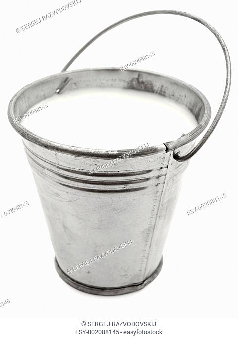 metal bucket with milk