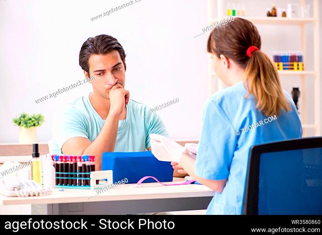 Young patient during blood test sampling procedure