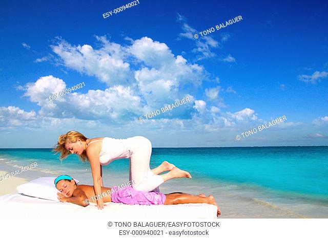 Caribbean beach therapy shiatsu massage on knees women in paradise