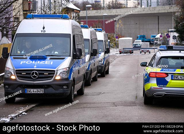 02 December 2023, Baden-Württemberg, Stuttgart: Police vehicles stand ready for a possible deployment. The police are supposed to prevent another clash between...