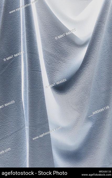 Close up inverted image of draped fleece fabric