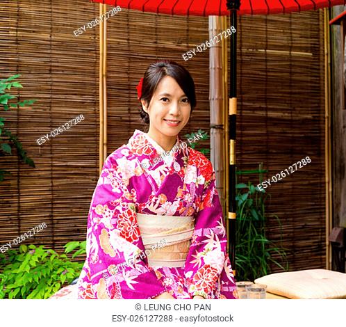 Asian Woman with kimono dress at tea house in japan