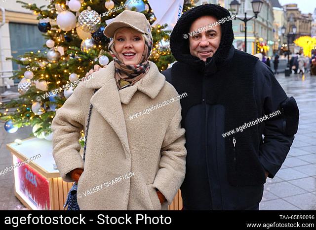 RUSSIA, MOSCOW - DECEMBER 19, 2023: Russian singer Valeriya (L) and her husband, music producer Iosif Prigozhin attend the opening of an exhibition of designer...
