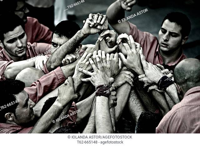 'Castellers' building human towers, a Catalan tradition. Barcelona province, Catalonia, Spain