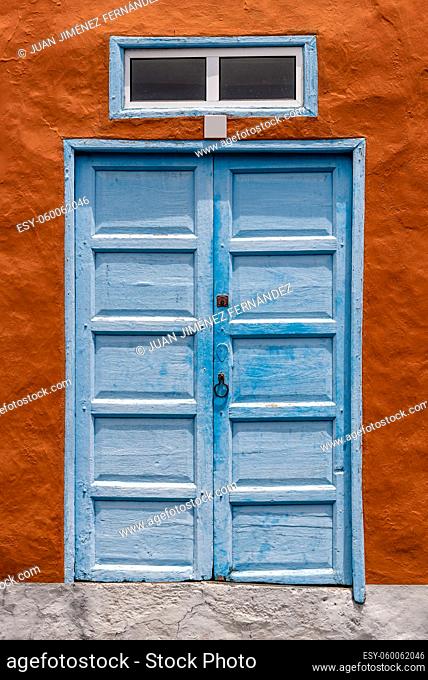 Traditional blue painted door in canarian colonial style house in the old town of Santa Cruz de La Palma, in the quarter of San Sebastian