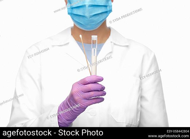 female doctor with test tube and cotton swab
