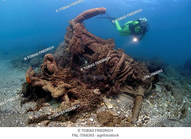 Diver with sunken anchor, Caesarea Maritima, Mediterranean Sea, Israel, underwater shot