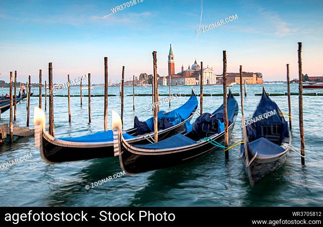 Venice Gondolas moored at the San Marco square or Piazza san Marco, and the San Giorgio Maggiore island at the back