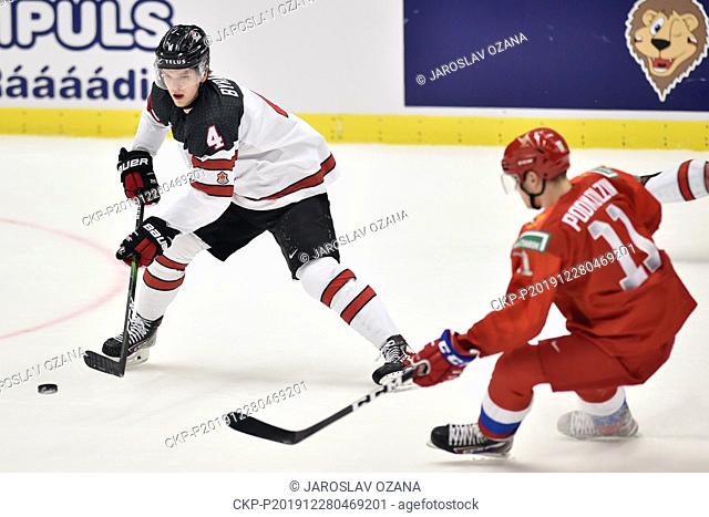 Bowen Byram of Canada, left, and Vasili Podkolzin of Russia in action during the 2020 IIHF World Junior Ice Hockey Championships Group B match between Russia...