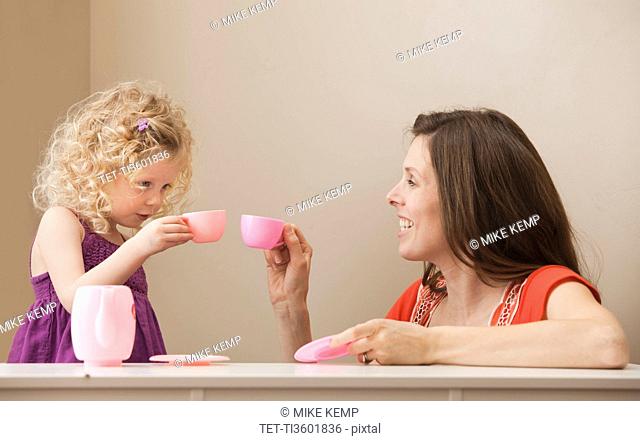 USA, Utah, Lehi, mother and daughter 2-30 having tea