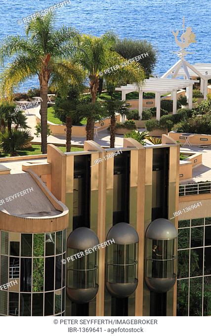 Roof garden with palm trees and elevators, Hotel Le Meridien Beach Plaza, Le Larvotto, Monaco, Cote d'Azur, Europe